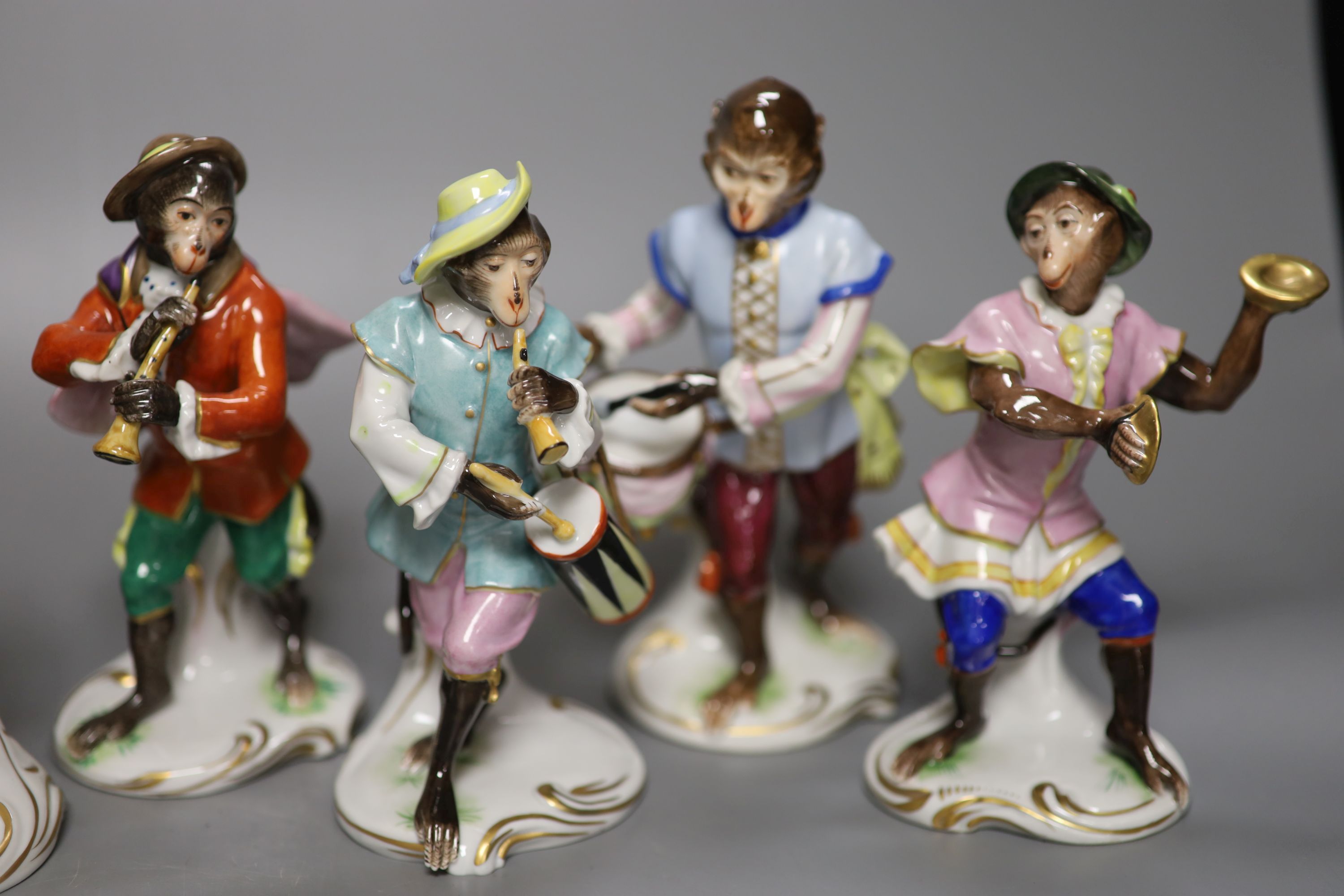 Seven German porcelain monkey band figures, height 15cm